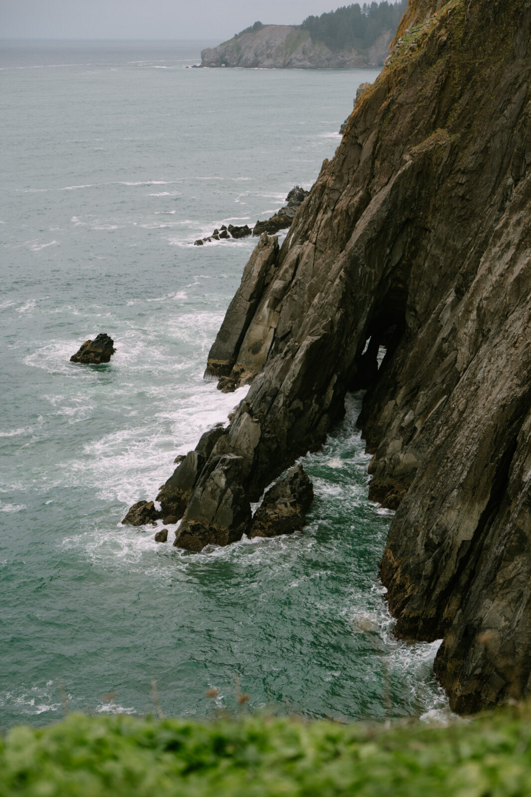Rugged Oregon Coast sea stacks rising from the Pacific Ocean on a cloudy day near Manzanita