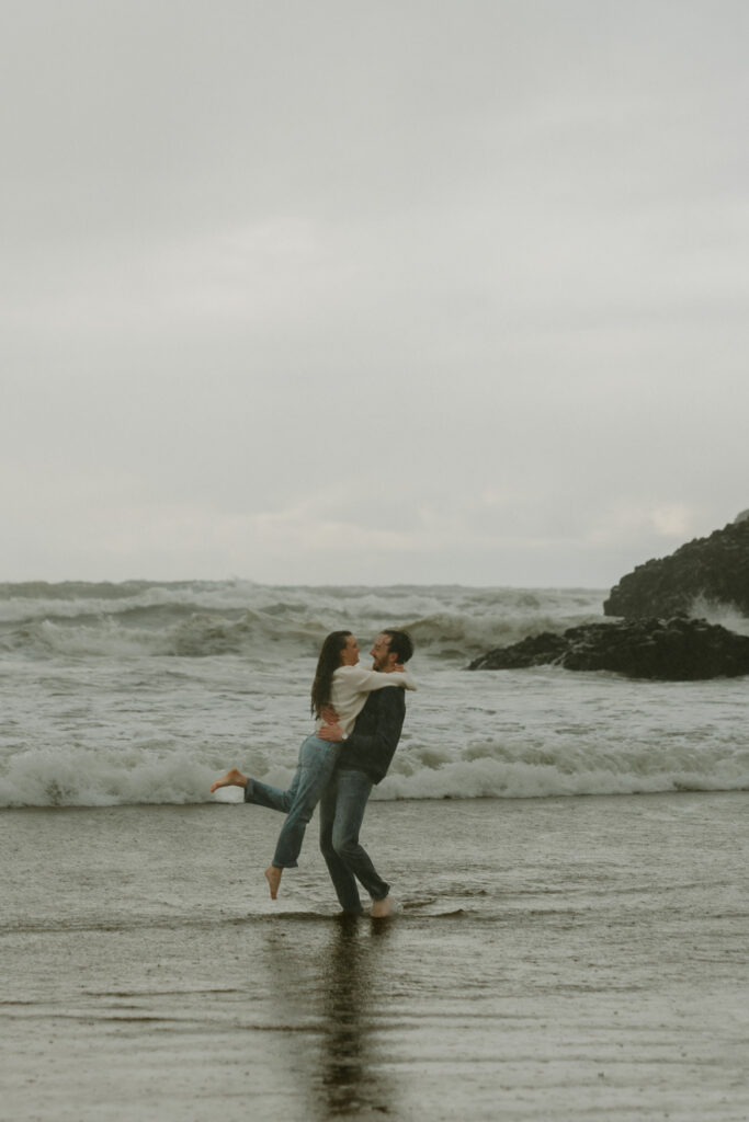 jumping in the ocean at cannon beach