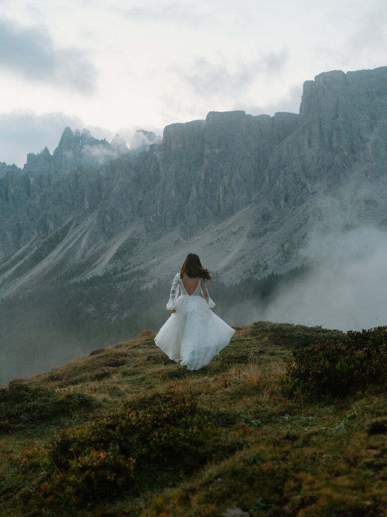 A couple poses for portraits during their elopement in the Italian Dolomites.