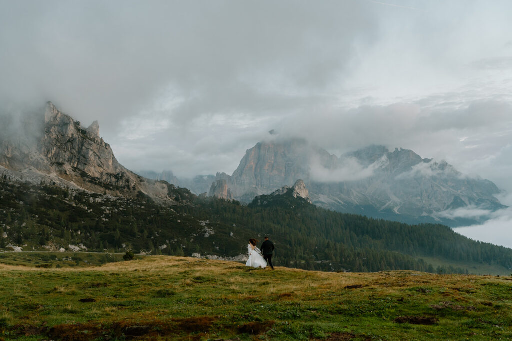 A couple poses for portraits during their elopement in the Italian Dolomites.