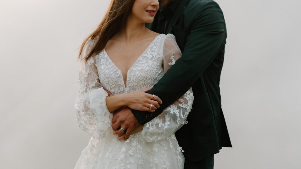 A couple poses for portraits during their elopement in the Italian Dolomites.