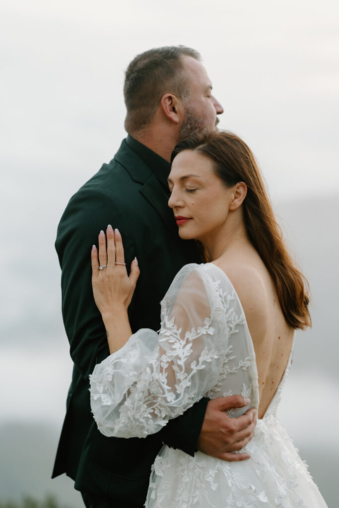 A couple poses for portraits during their elopement in the Italian Dolomites.