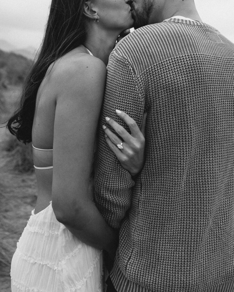 A couple poses for their Oregon Coast engagement photo session.