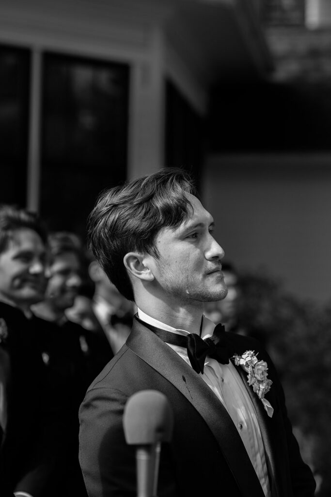 The moment Zach sees Amanda walking toward him at their Roche Harbor Resort garden ceremony — San Juan Island wedding photography by Voyage + Vine.