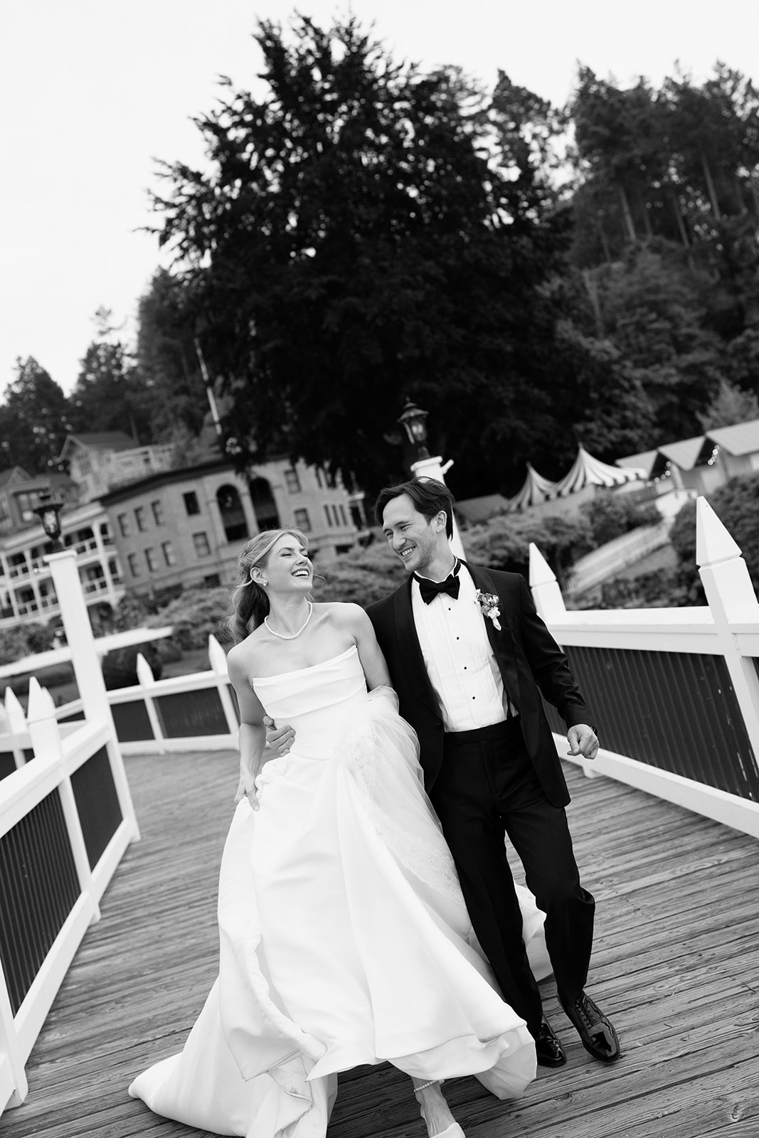 Sunset portraits on the docks at Roche Harbor Resort, San Juan Island — boats, water, golden light, and these two completely in their own world