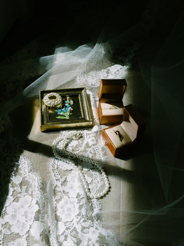 Wedding details at Roche Harbor Resort — lace veil, heirloom ring box, and handwritten vows. San Juan Island wedding photographer: Voyage + Vine.