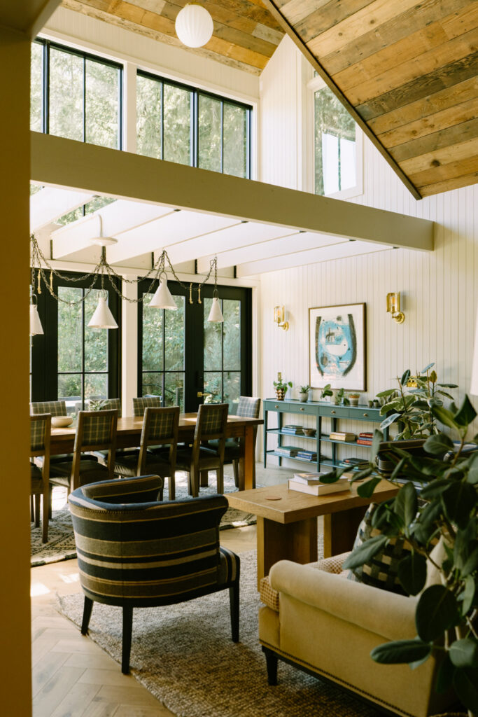 Interior photo of wedding venue, Carly Estate, with white painted walls and modern, mid-century decor.