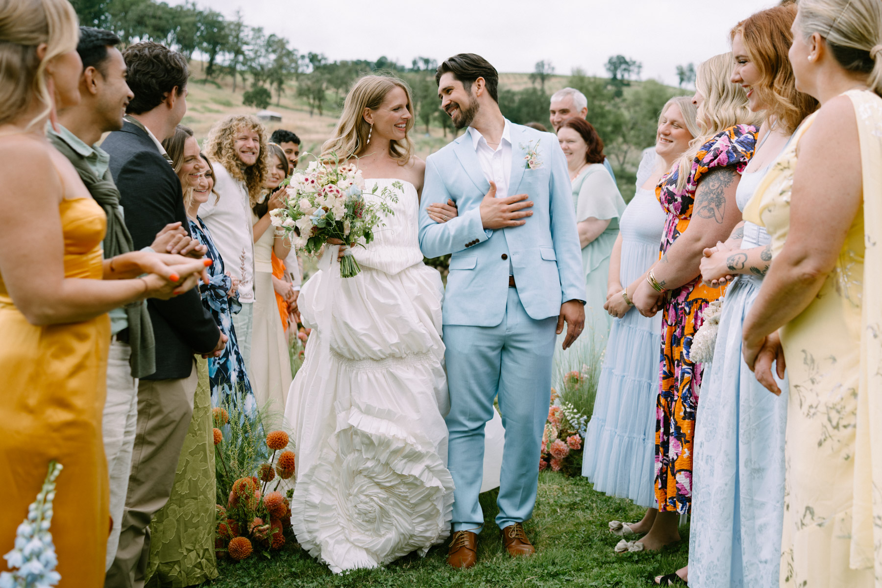 A couple walks down the aisle during their wedding day at Maysara Winery. 