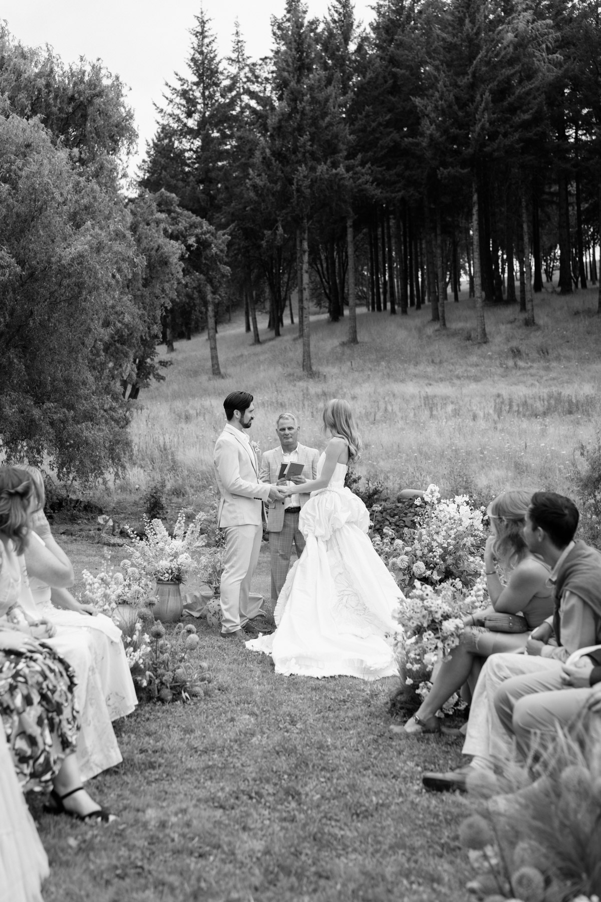 Guests seated for the ceremony beneath the trees at Maysara Winery