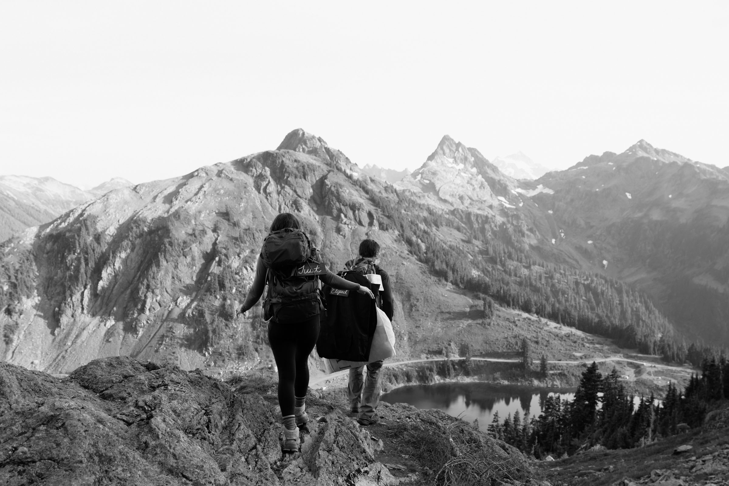 Couple pausing to take in North Cascades views during their hiking elopement