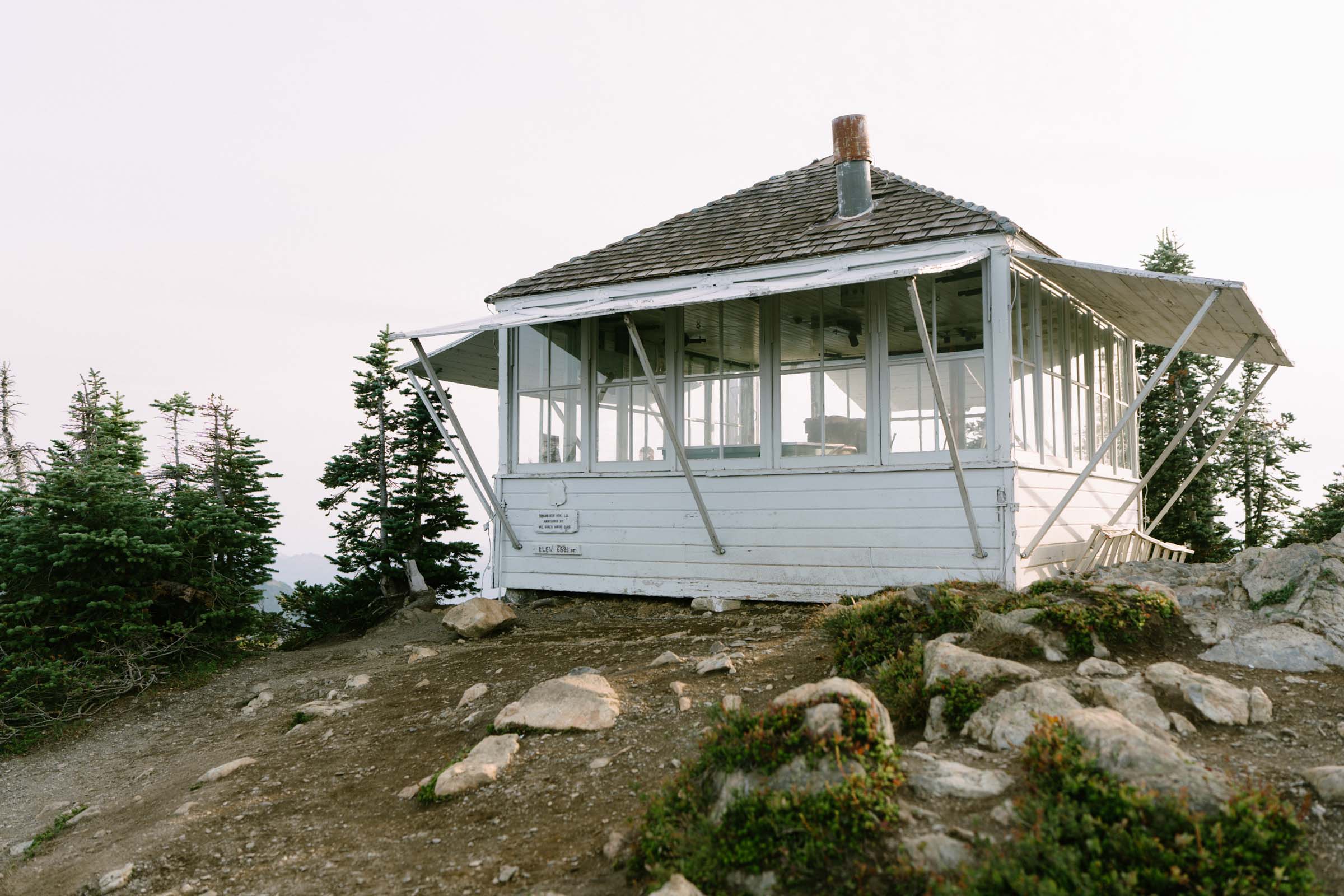 Winchester Mountain fire lookout standing on the rocky summit in the Mt. Baker Wilderness